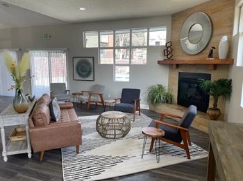 A living room with a fireplace and a mirror on the wall.